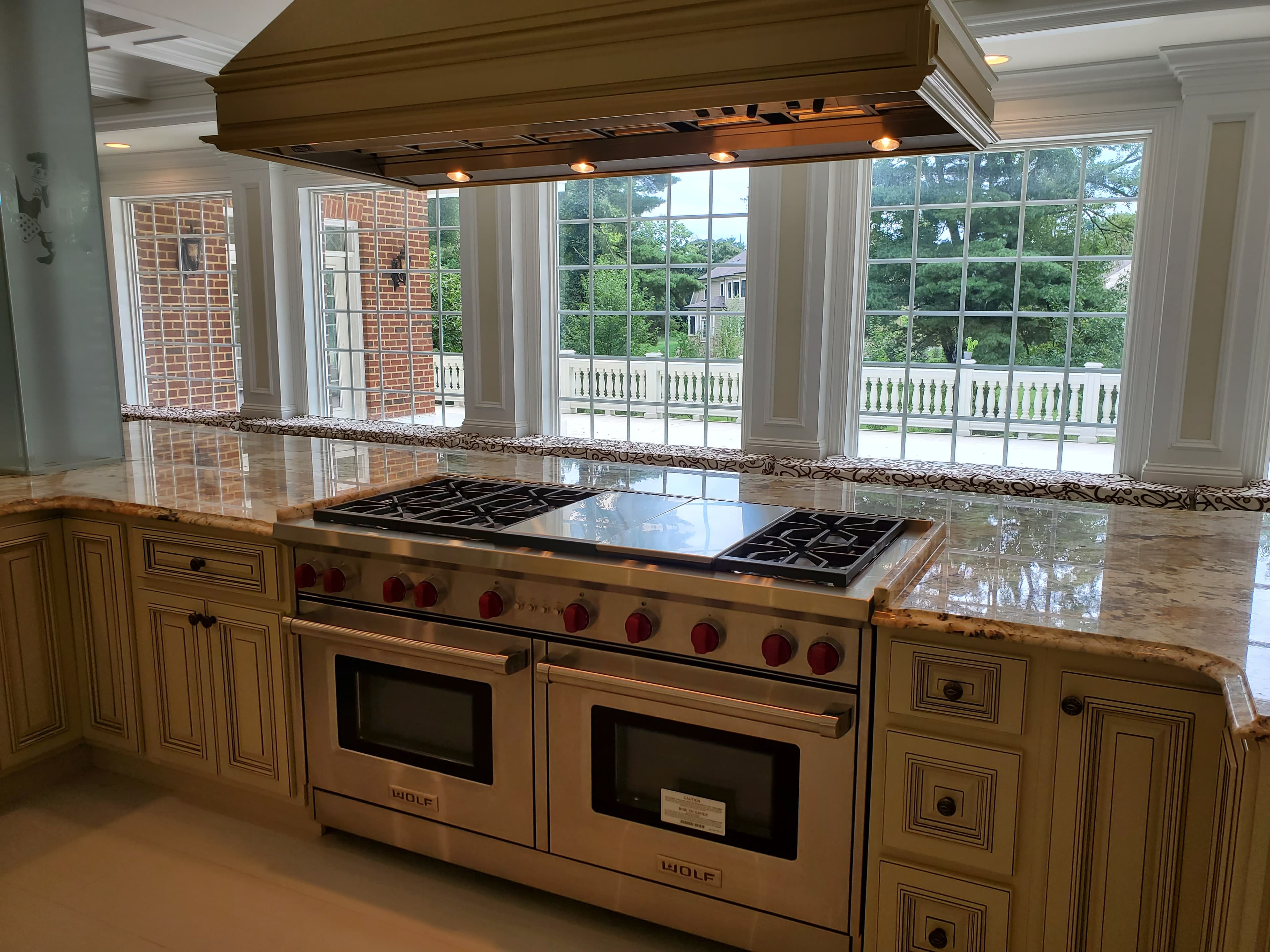 Luxury living room with coffered ceiling and linear fireplace